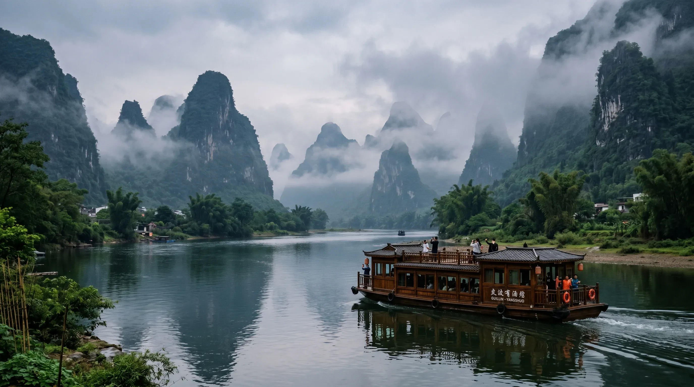 River cruise boat on the Li River from Guilin to Yangshuo, Guangxi, China - karst mountains